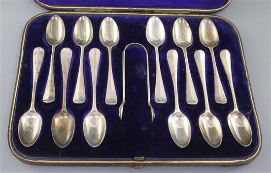 A cased set of twelve Victorian silver Hanovarian rat tail pattern teaspoons, and matching tongs, London 1879.